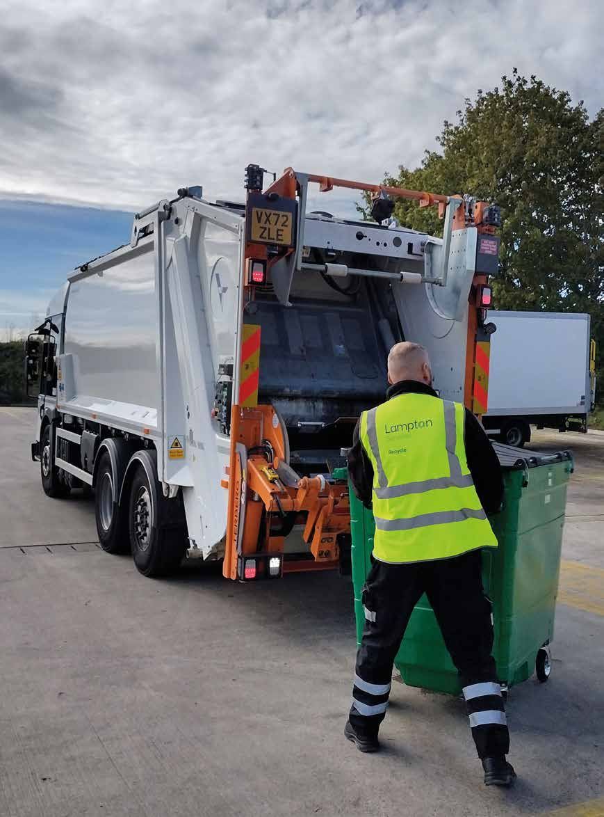 A Lampton Recycle 360 crew member emptying a wheelie bin into a collection lorry